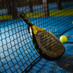 Elvone Power Pro padel racket resting against the net, showcasing its sleek design and superior performance features.