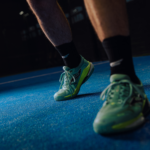 Athlete wearing black Performance Socks, demonstrating comfort and flexibility during a padel game. Ideal for athletes seeking quality performance gear.