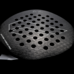 Side view of the Elvone Hybrid Pro padel racket, showcasing the 3D-pattern textured surface for enhanced spin and grip. Medium EVA core for perfect playability.