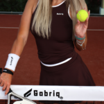 Close-up of woman wearing Gabriq brown performance set showcasing flattering fit and premium fabric